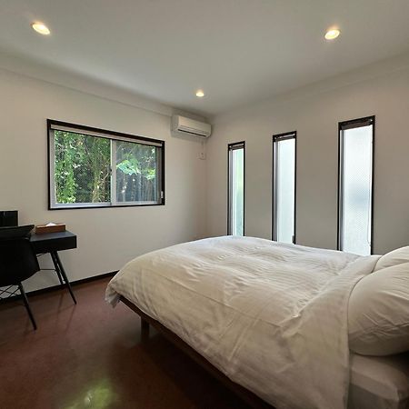 Ferienwohnung White Reef Uruma Exterior foto